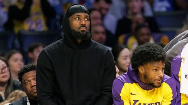 Lakers coach unsure on James return after defeat 1 LeBron James (left) was on the bench with son Bronny against the Portland Trail Blazers