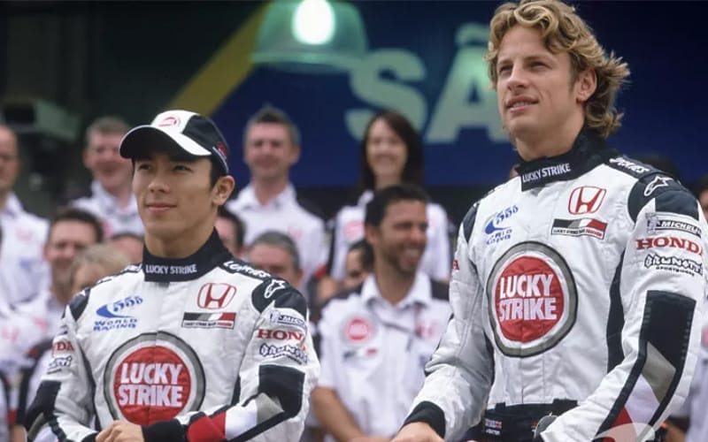 BAR-Honda photoshoot: Jenson Button and Takuma Sato pose with BAR-Honda team members
