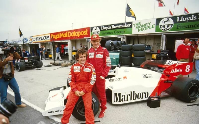 McLaren team-mates Alain Prost and Niki Lauda, pose for a team shot
