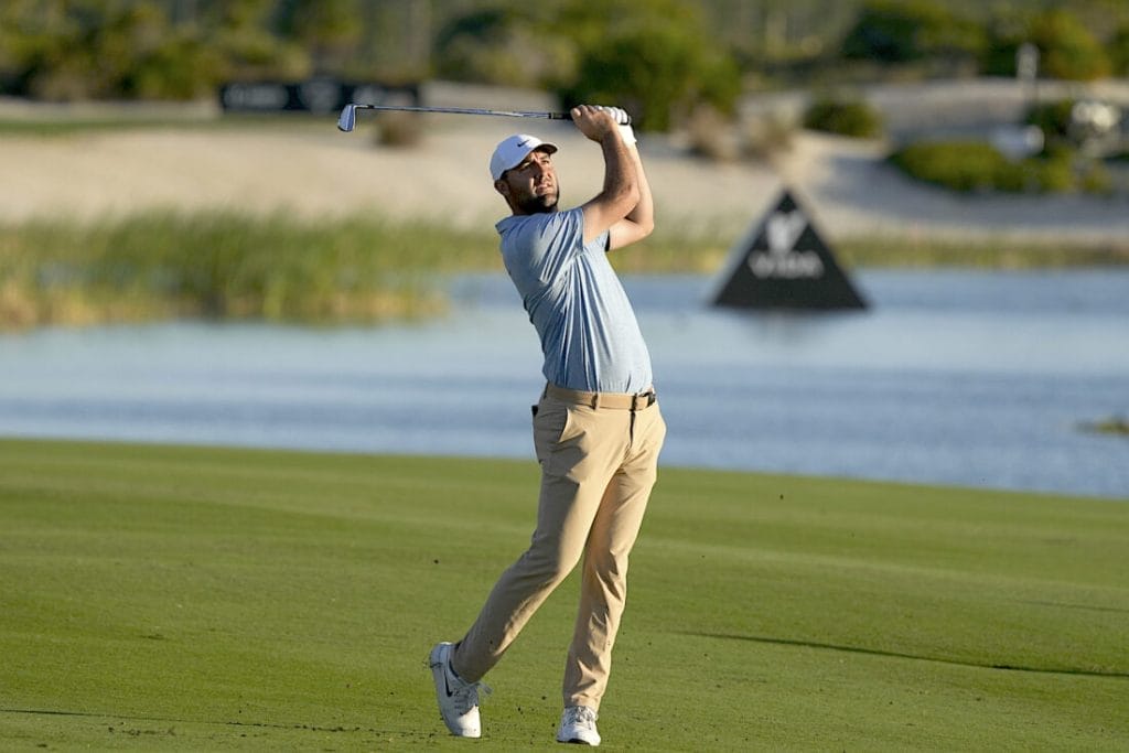 Scheffler matches Woods with third PGA Tour award - golf pga leaderboard 2 Scottie Scheffler, of the United States, watches his shot from the 18th fairway during the final round of the Hero World Challenge PGA Tour at the Albany Golf Club in New Providence, Bahamas, Sunday, Dec. 8, 2024. (AP Photo/Fernando Llano)