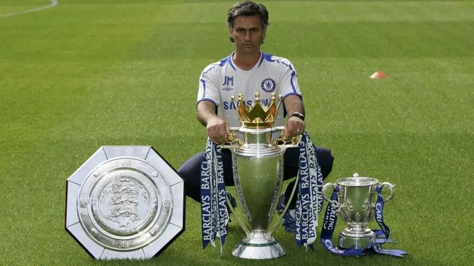 Jose Mourinho won the Carling Cup (right) in his first season as Chelsea boss and months later added the Premier League (centre)

