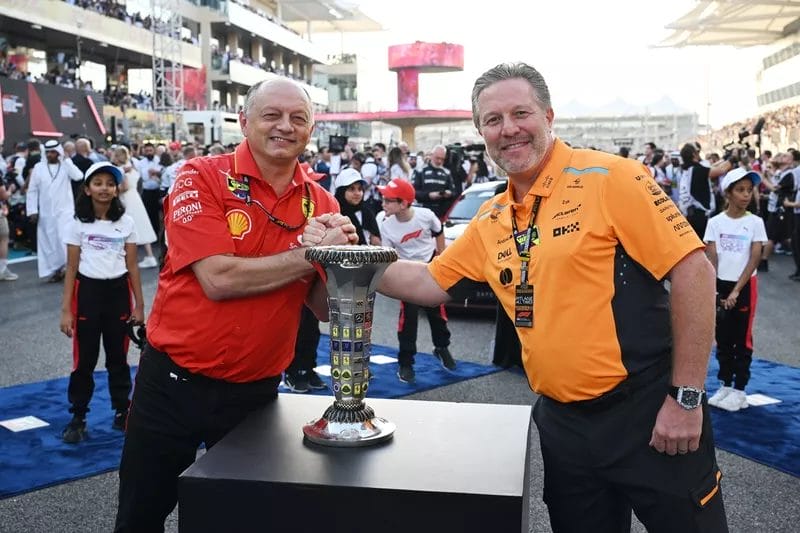Scuderia Ferrari Team Principal and General Manager Frederic Vasseur and McLaren Racing CEO Zak Brown on the grid with the Constructors Championship trophy before the start