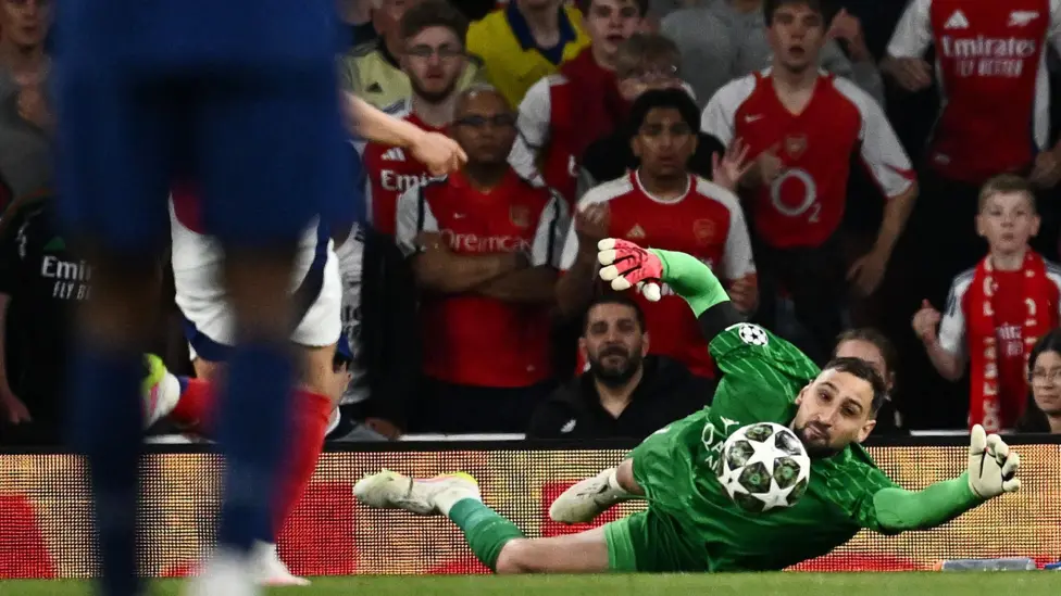 Gianluigi Donnarumma made two superb saves to keep out Arsenal last week - this stop from Gabriel Martinelli, and another to deny Leandro Trossard