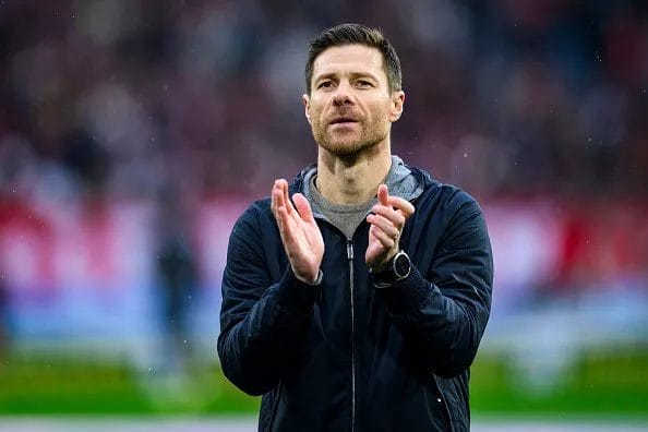 Xabi Alonso applauds the crowd.