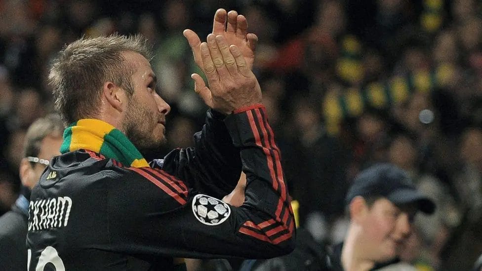 During his time at LA Galaxy, Beckham had two loan spells at AC Milan. After a Champions League defeat by Manchester United at Old Trafford, Beckham draped a green and gold scarf - symbolic of United fans' protests against the Glazer family's ownership of the club - around his neck. He later said he wasn't aware of the scarf's association with the anti-Glazer campaign.

